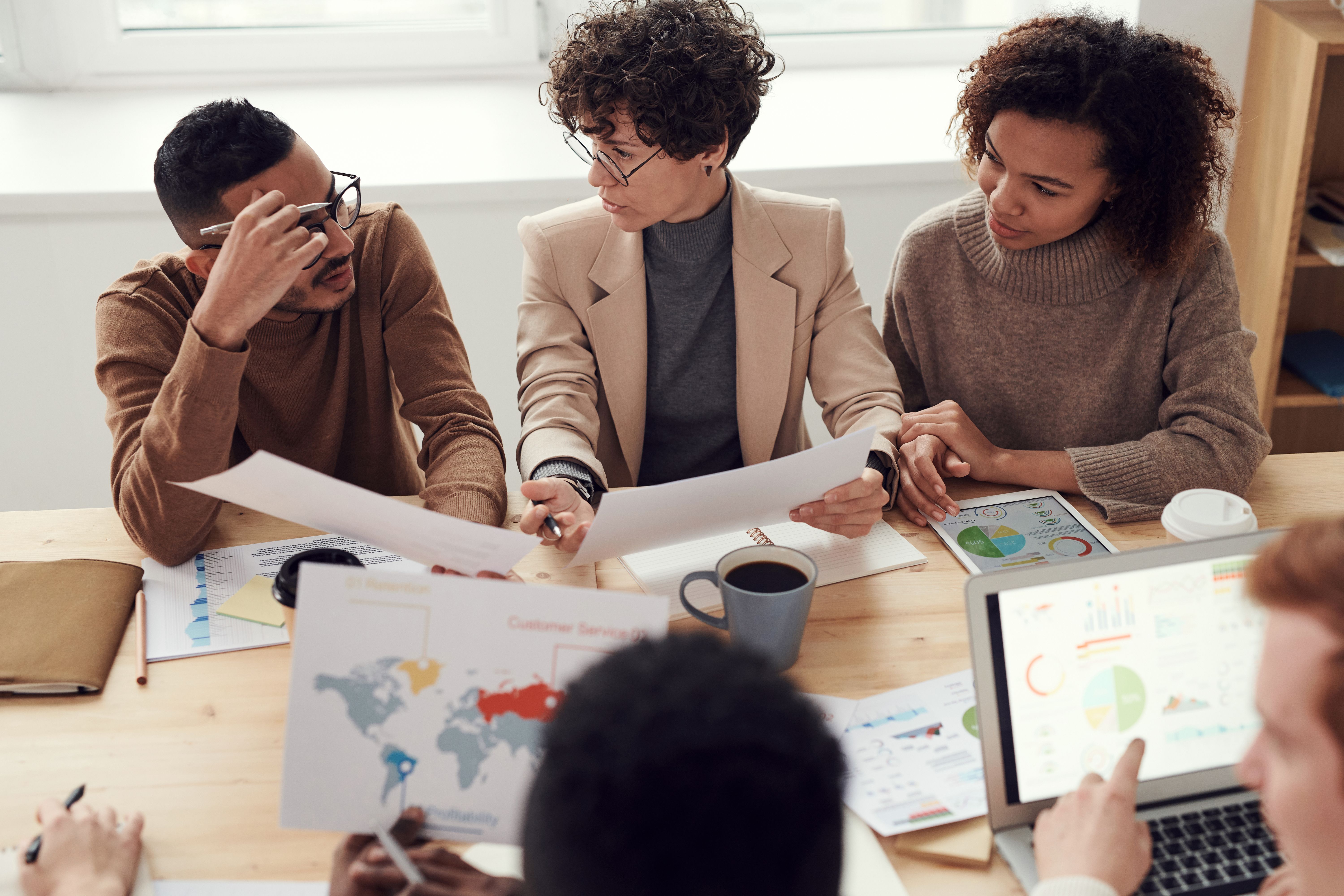 A business team collaborating over documents